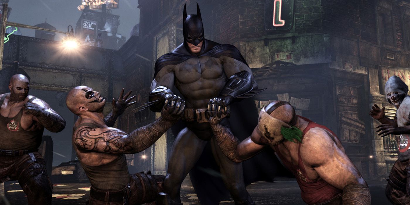 A screenshot from Batman: Arkham City showing the Dark Knight fighing some Joker minions.