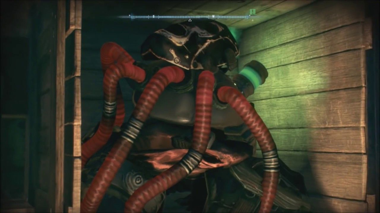 Uma captura de tela da máscara de Bane e do tanque Venom como um ovo de Páscoa em Batman Arkham Knight.