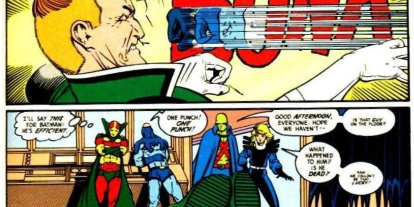 Batman knocks out Guy Gardner in front of other Justice League members.