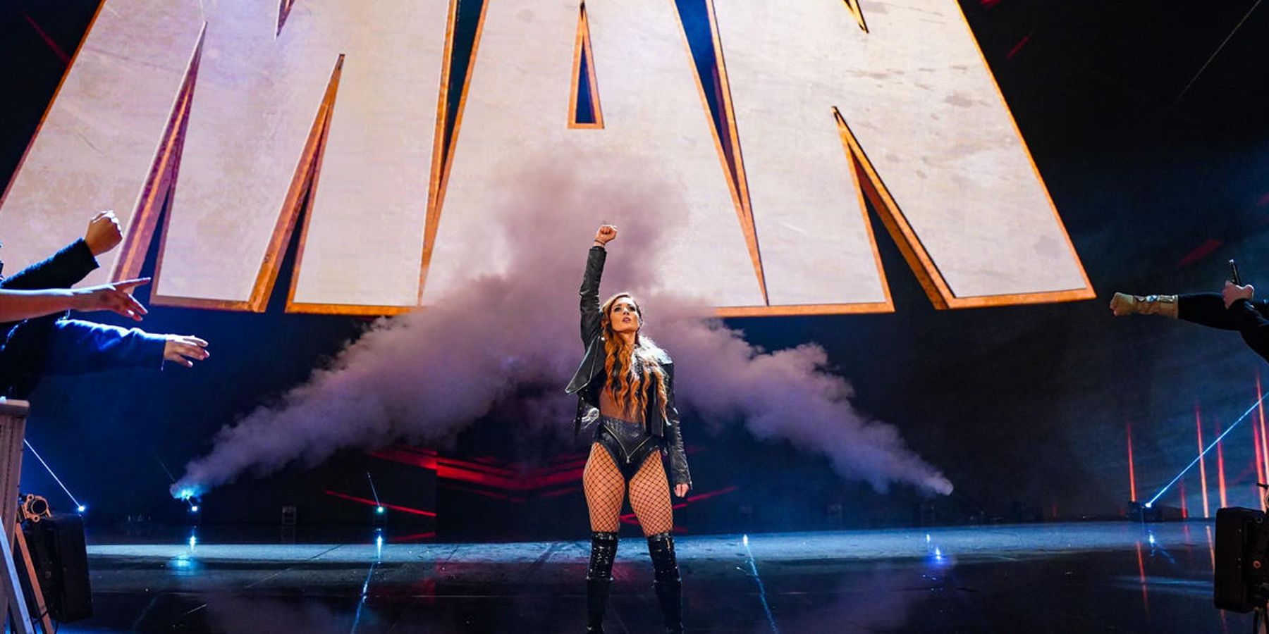 Becky Lynch makes her entrance during WWE's Raw is 30 show, before having her steel cage match against Bayley cut short.
