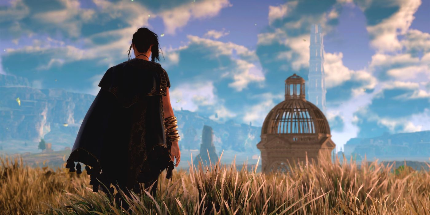 Frey standing in a field and looking out at some buildings in the distance in Forspoken.