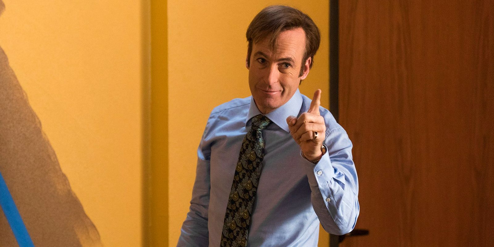 Bob Odenkirk as Saul Goodman pointing and smiling in Better Call Saul