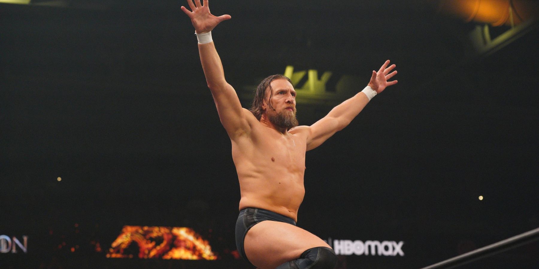 Bryan Danielson strikes his signature pose while playing to the crowd during an episode of AEW Dynamite in 2022.