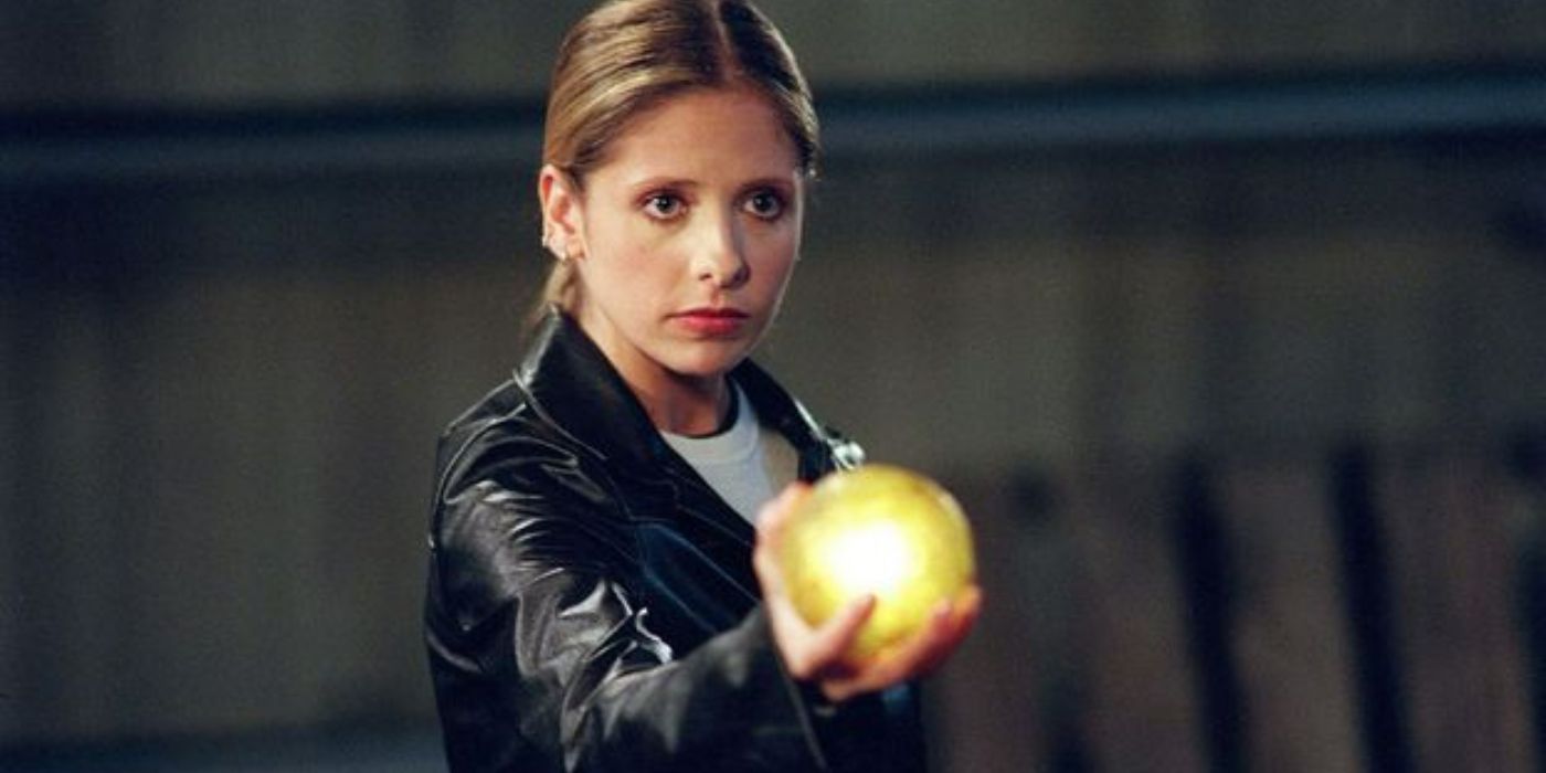 Buffy holding a ball in her hand in Vampire Slayer