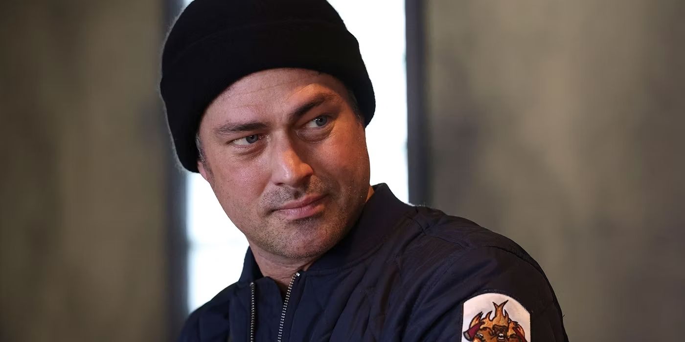 Chicago Fire Taylor Kinney as Kelly Severide looking over his shoulder