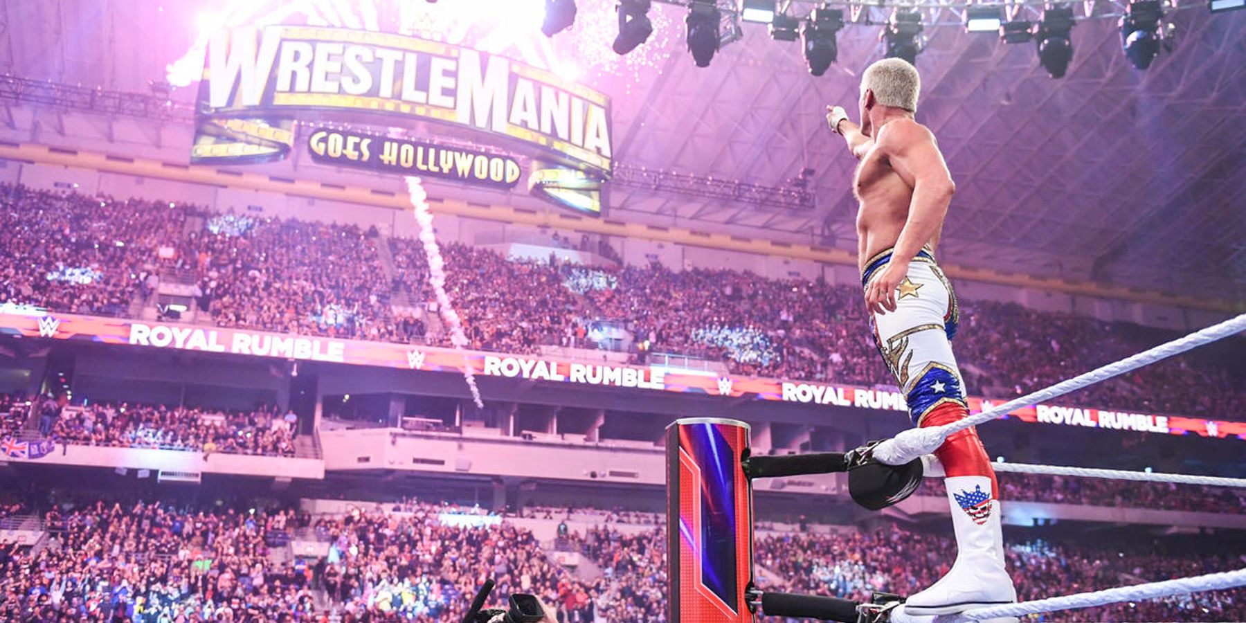 Cody Rhodes points to the WrestleMania sign after winning the men's Royal Rumble match in 2023.