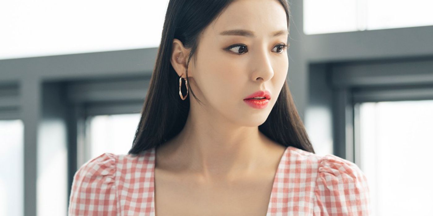 Lee Da-hee looks concerned at something off screen in gingham top