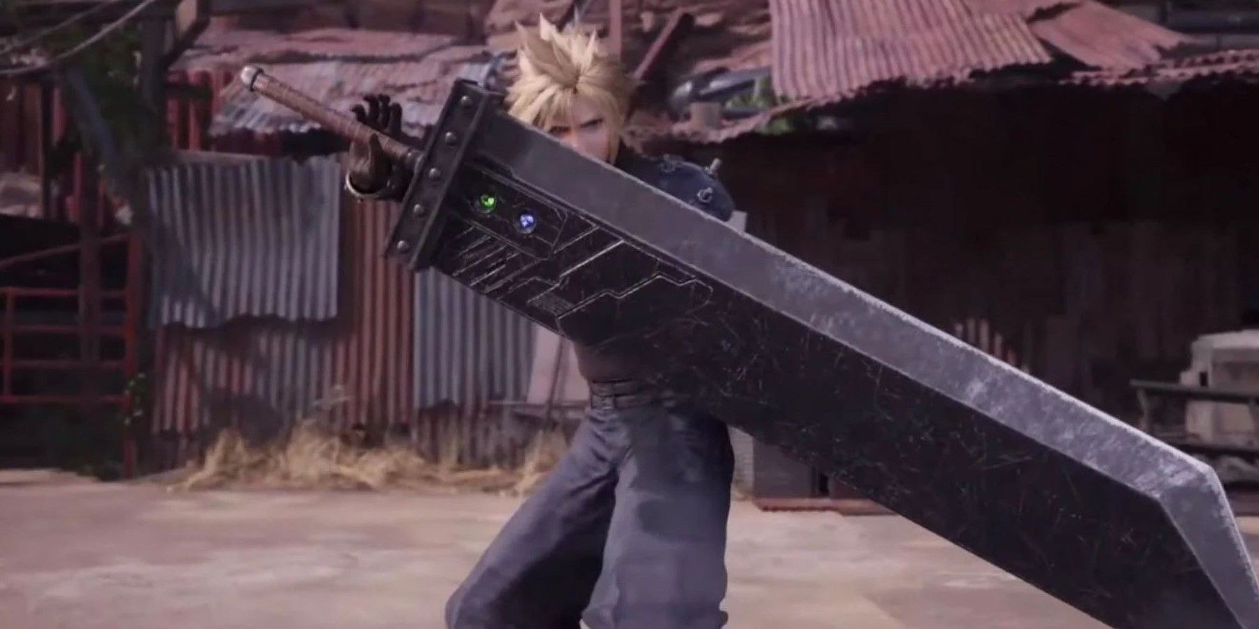 Cloud holding the Buster Sword, a weapon that belonged to Angeal and then Zack, in front of some scrap metal buildings.