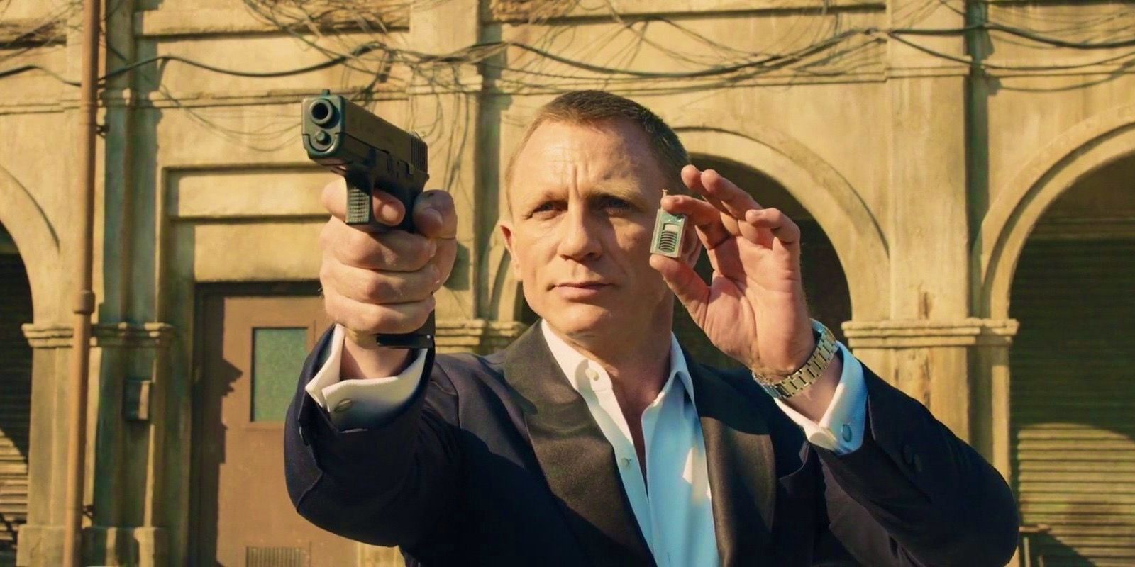 daniel craig as james bond with radio in spectre