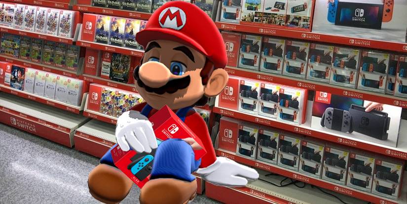 Mario looks sad as he holds onto his Switch in front of a Nintendo display in a game shop