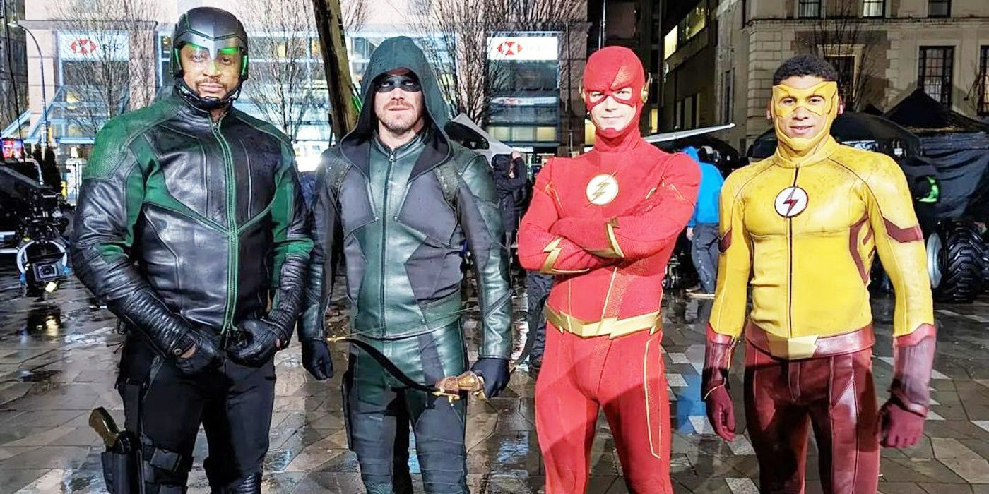 Diggle, Green Arrow, The Flash And Kid Flash line up in a filming set for The Flash