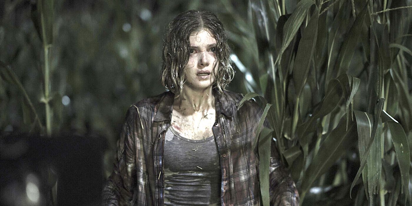 Elena Kampouris in Children of the Corn remake standing amid cornstalks, soaking wet and bedraggled