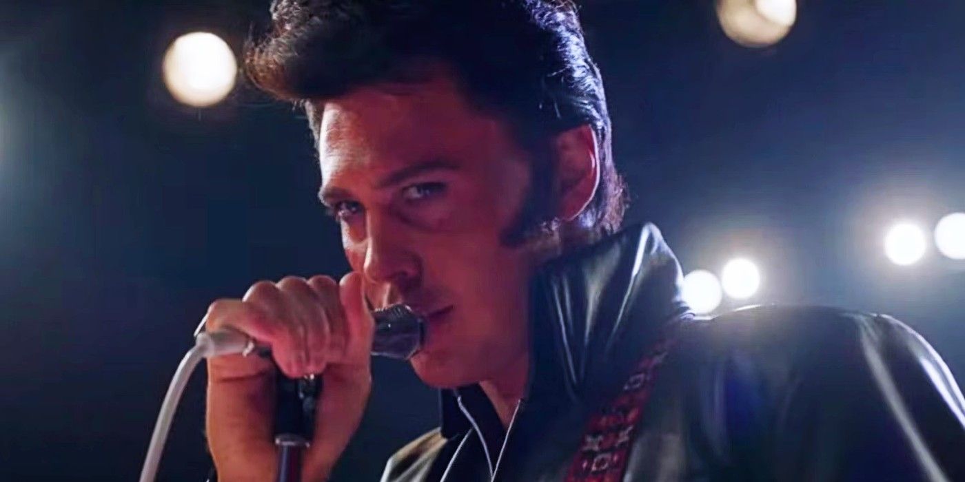 Austin Butler as Elvis Presley sings into a microphone