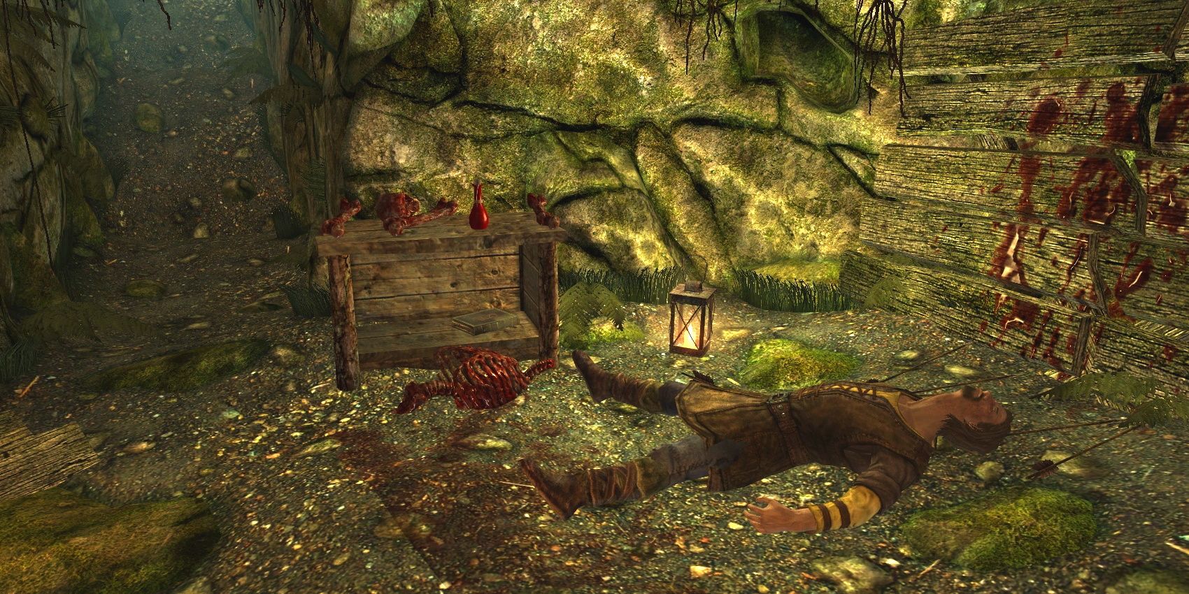 The remains of Leifnarr in Skyrim, laying in a cave next to a wooden wall covered in blood.