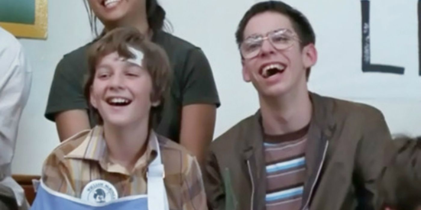 Herbert wearing a cast and laughing with Bill in Freaks and Geeks