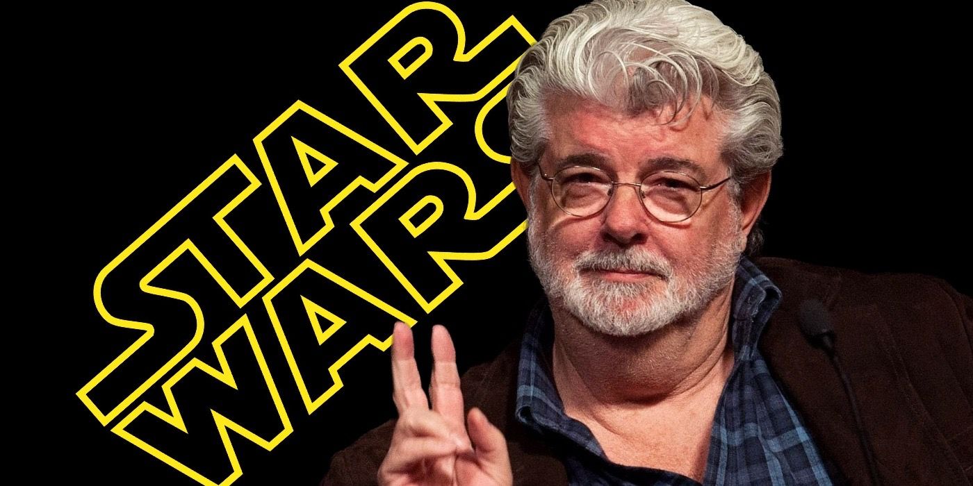 George Lucas in front of the Star Wars logo.