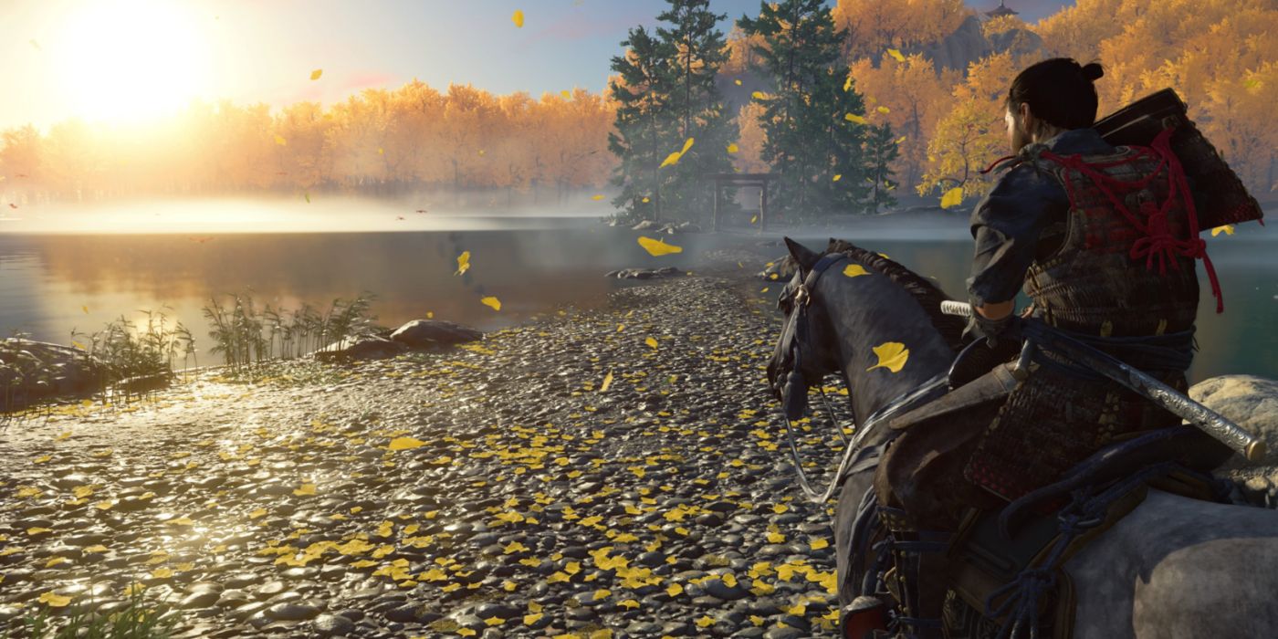 Ghost of Tsushima gameplay featuring Jin on horseback overlooking a lake.