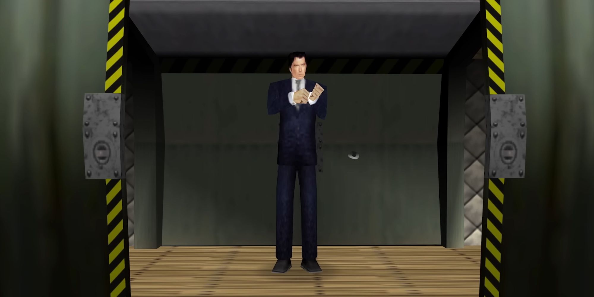 A screenshot from GoldenEye 007 showing James Bond standing and adjusting his suit as blast doors close in front of him.