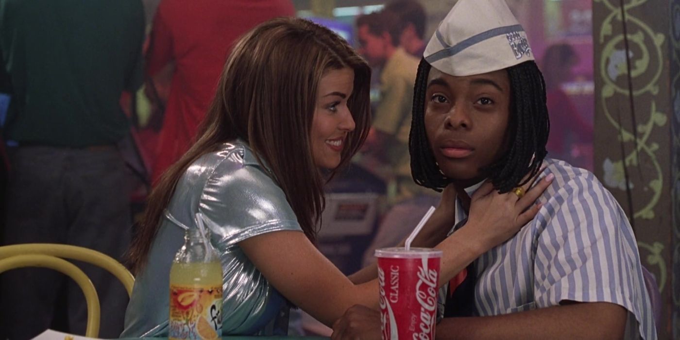 Roxanne touching Ed's shoulders while he looks surprised in Good Burger