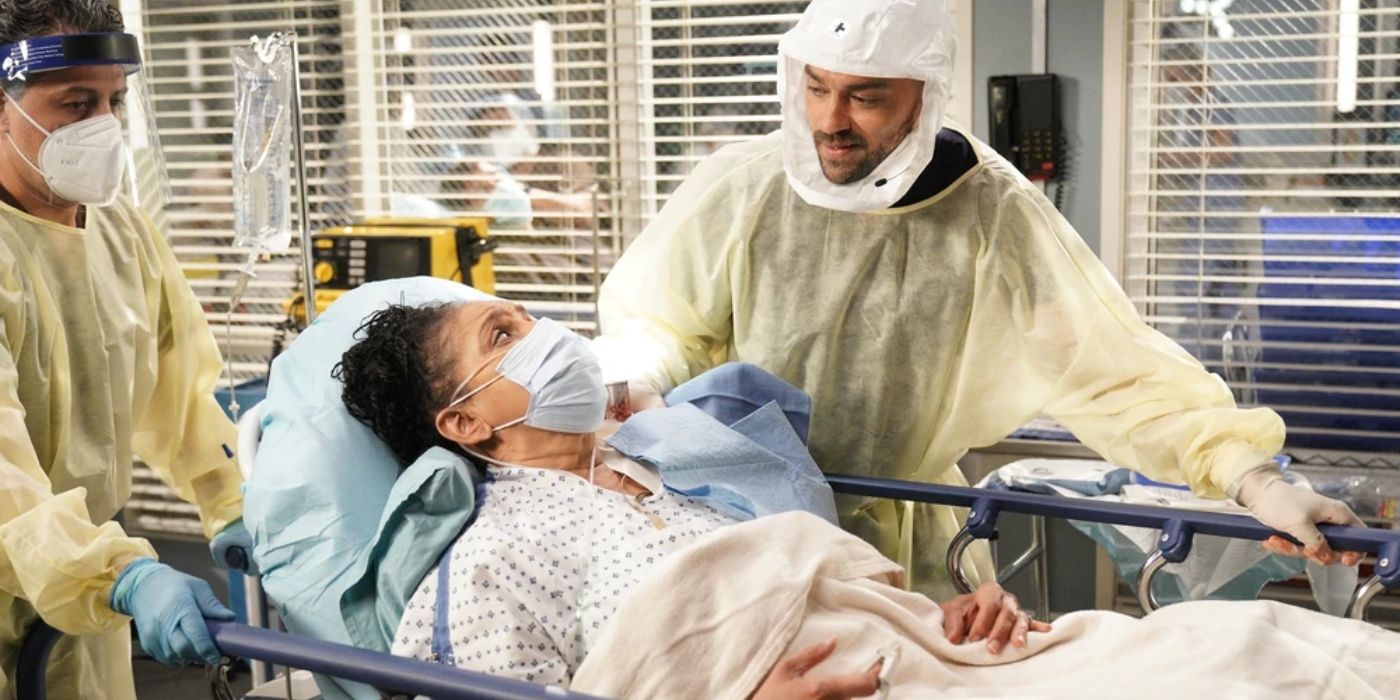Nell Timms lying in a hospital bed with Jackson standing by her side on Grey's Anatomy