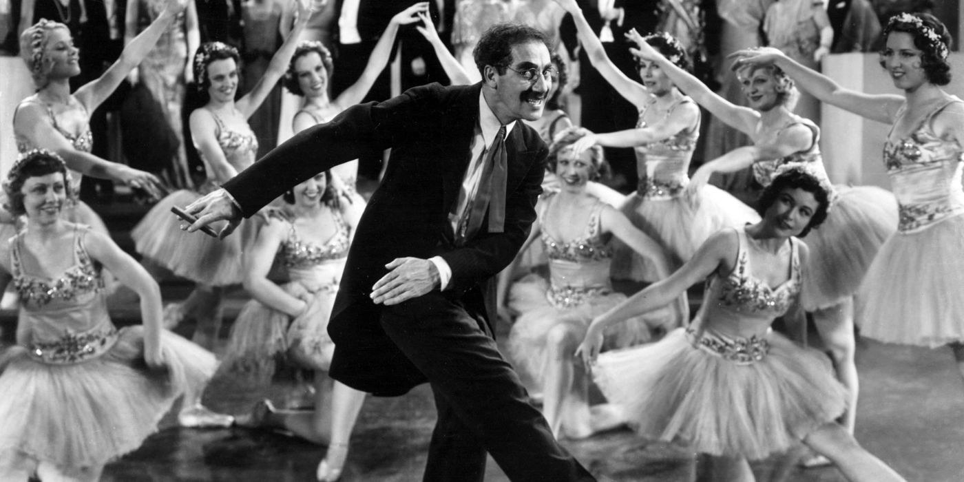 groucho marx as rufus t. firefly dancing in front of ballerinas in duck soup