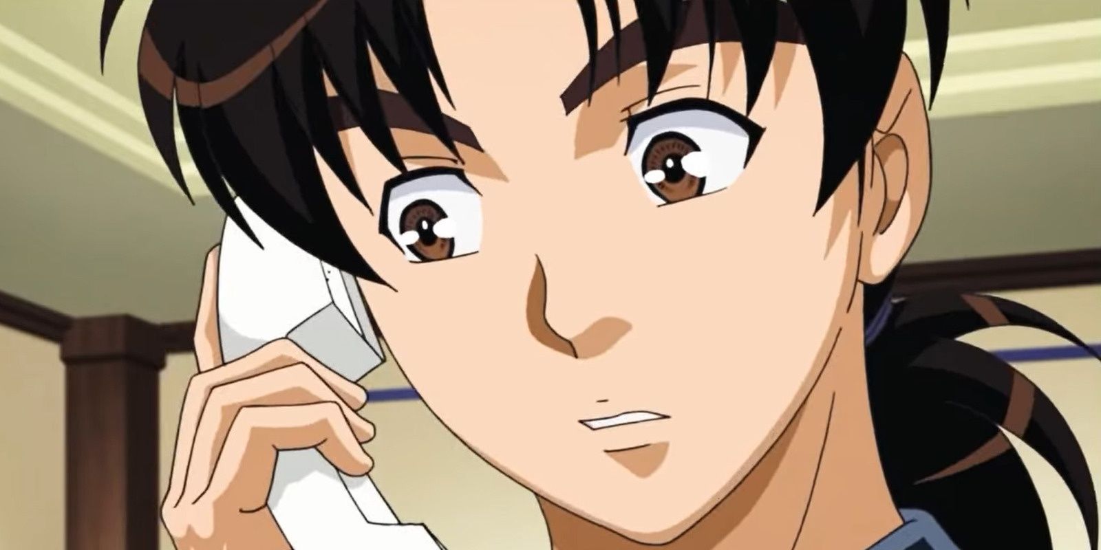Hajime Kindaichi answering the phone in The Kindaichi Case Files.