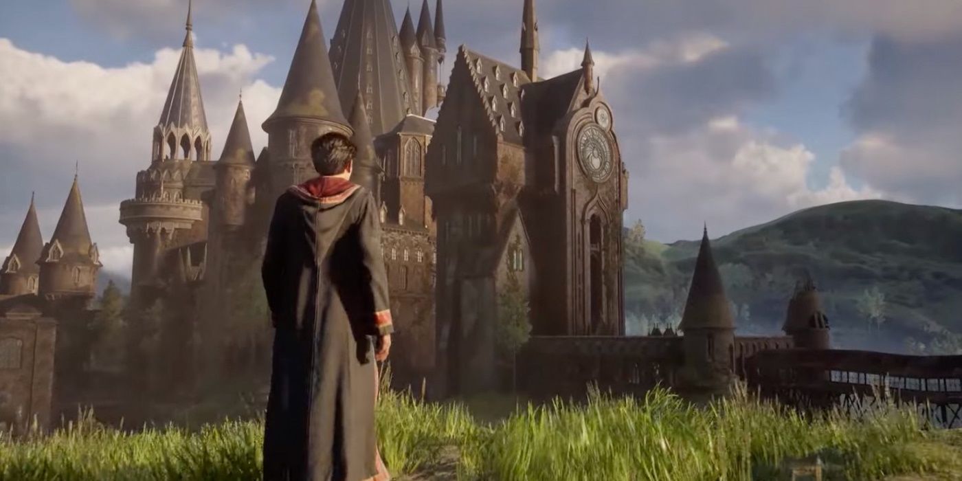 Hogwarts Legacy school in background with student standing looking at it
