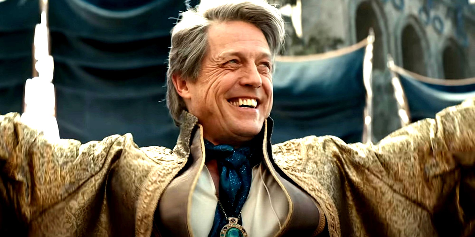 Hugh Grant smiling in Dungeons & Dragons: Honor Among Thieves