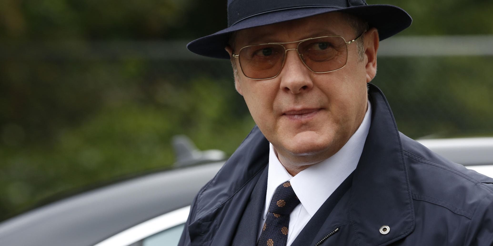 Raymond Reddington (James Spader) in The Blacklist wearing a top hat and sunglasses