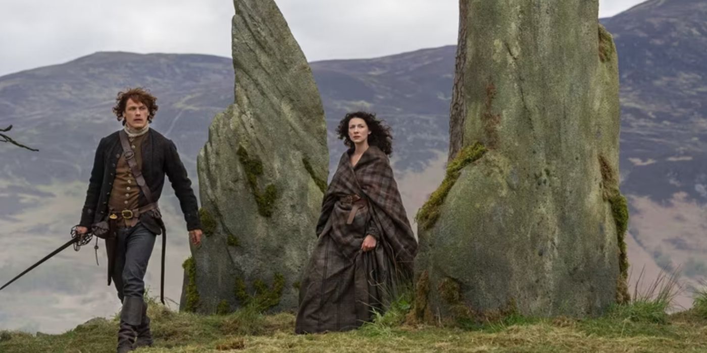 Jamie and Claire walking in Outlander.