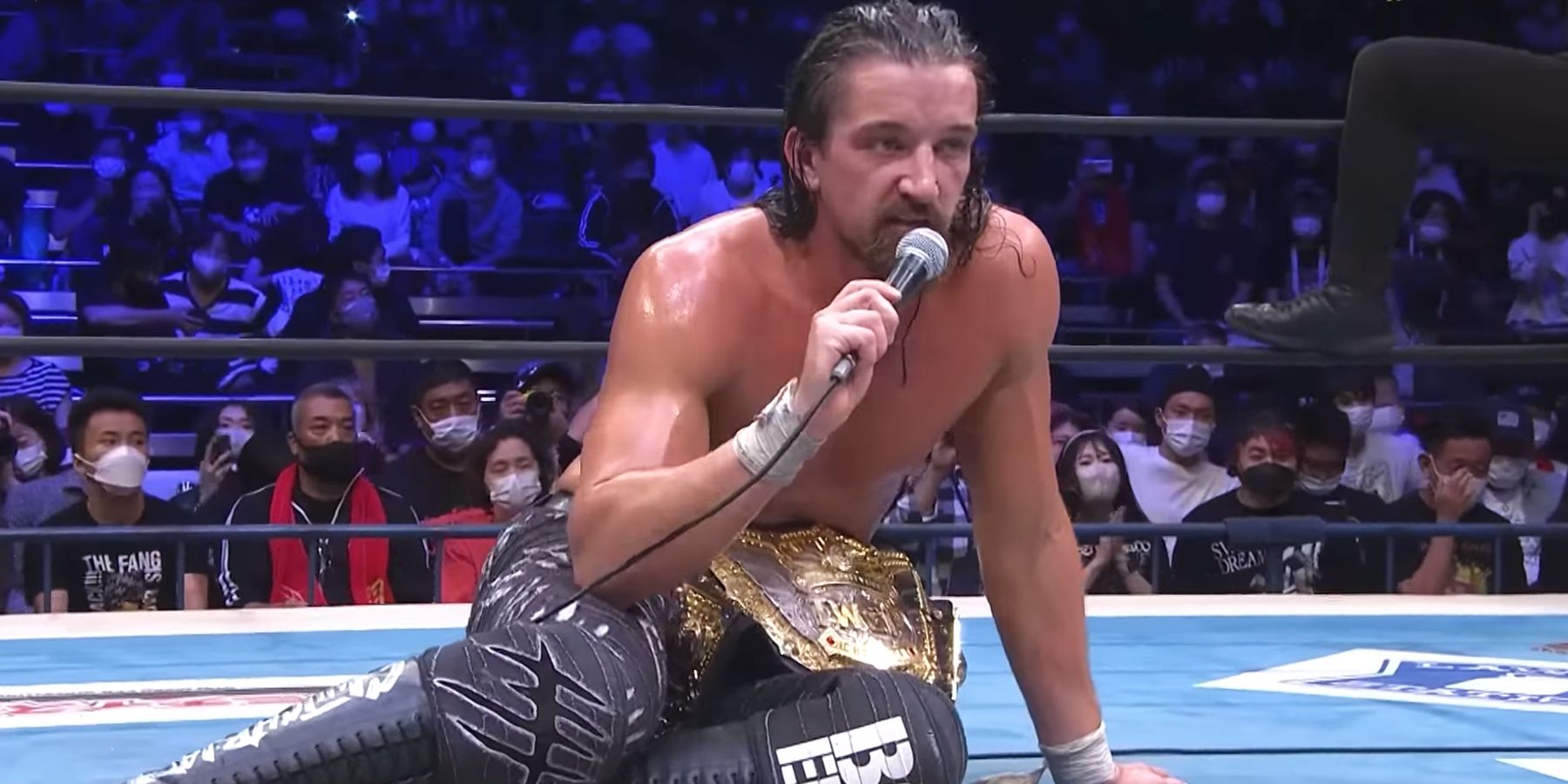 Jay White addresses NJPW fans after winning a match early in 2022.