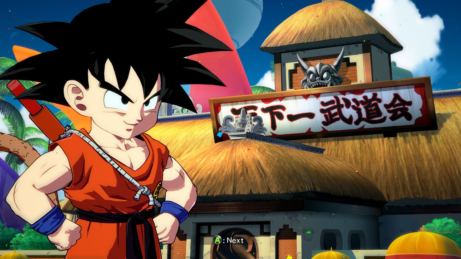 A young Goku is seen weilding his power pole and wearing his trademark Orange GI while standing on the stage of the World Martial Arts Tournment.