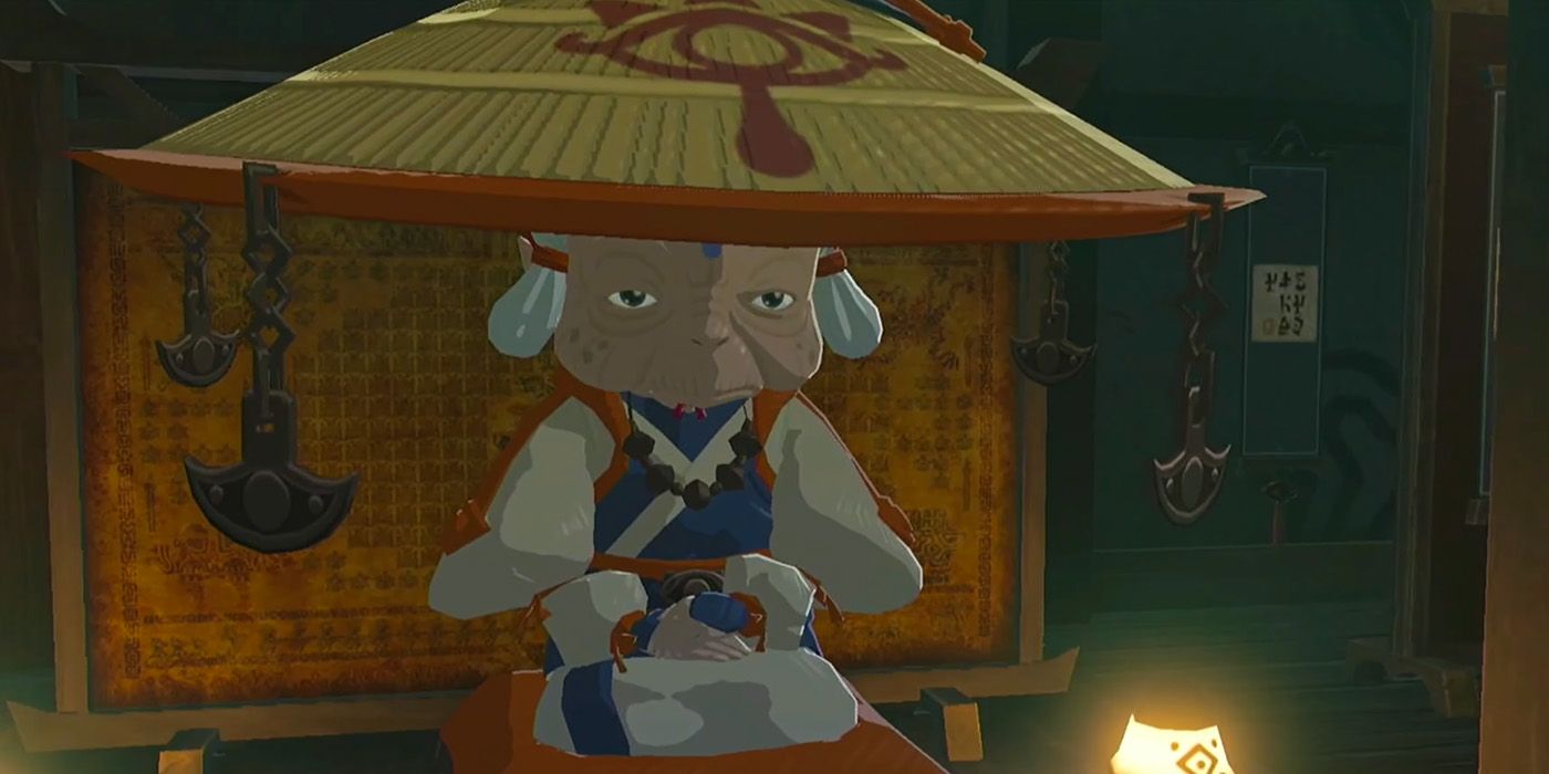 Impa sitting on her tall cushion in her house in Legend of Zelda BOTW.