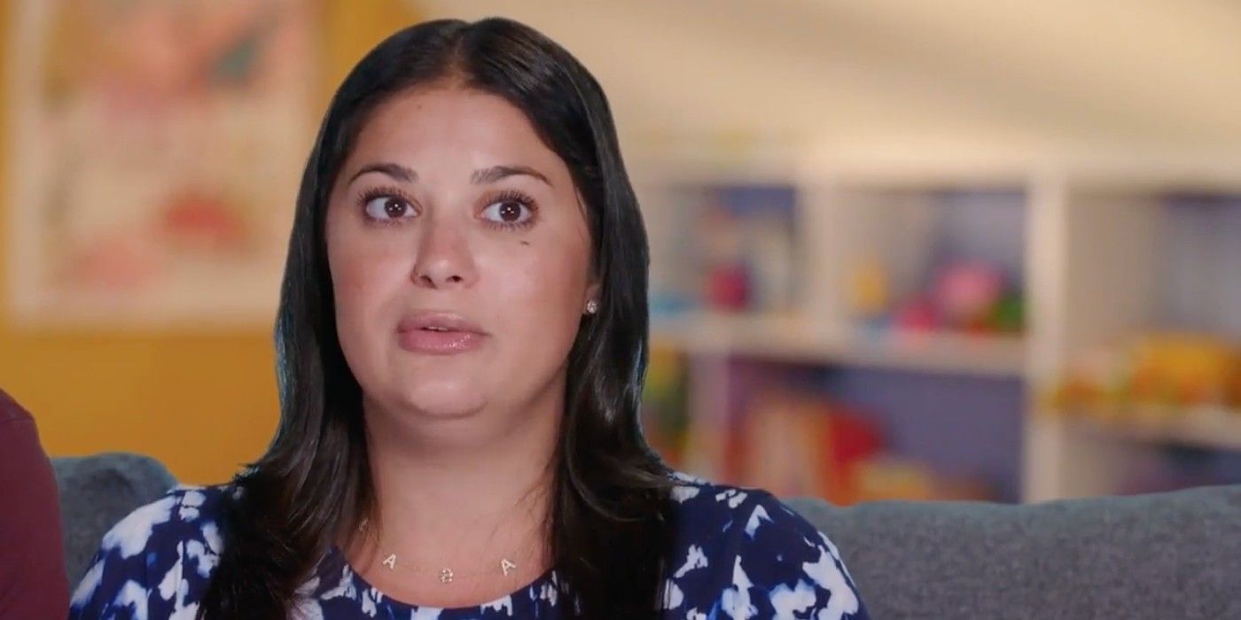 Loren Brovarnik on 90 Day Fiancé in blue white printed dress talking during confessional