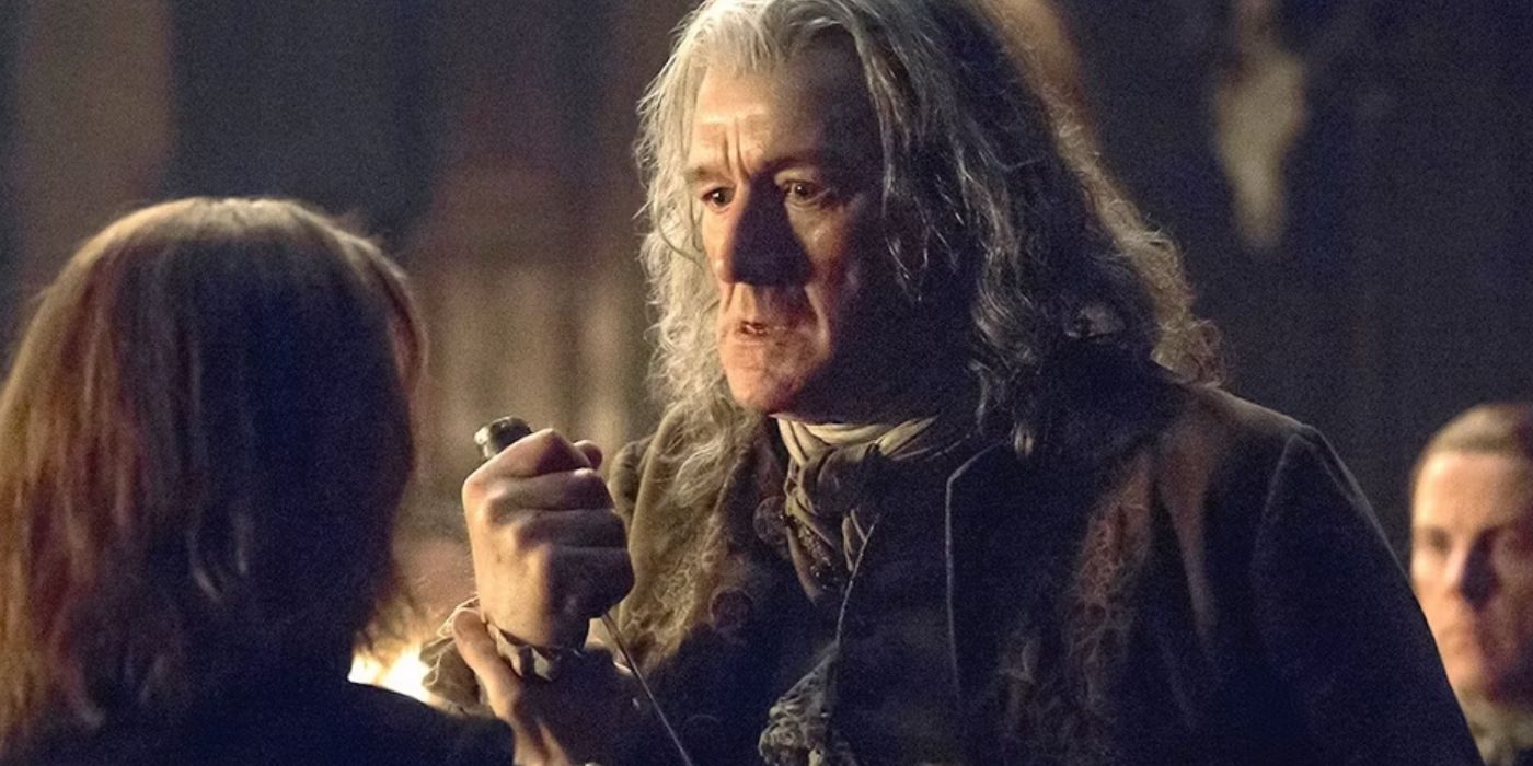 Lord Lovat with a knife in Outlander