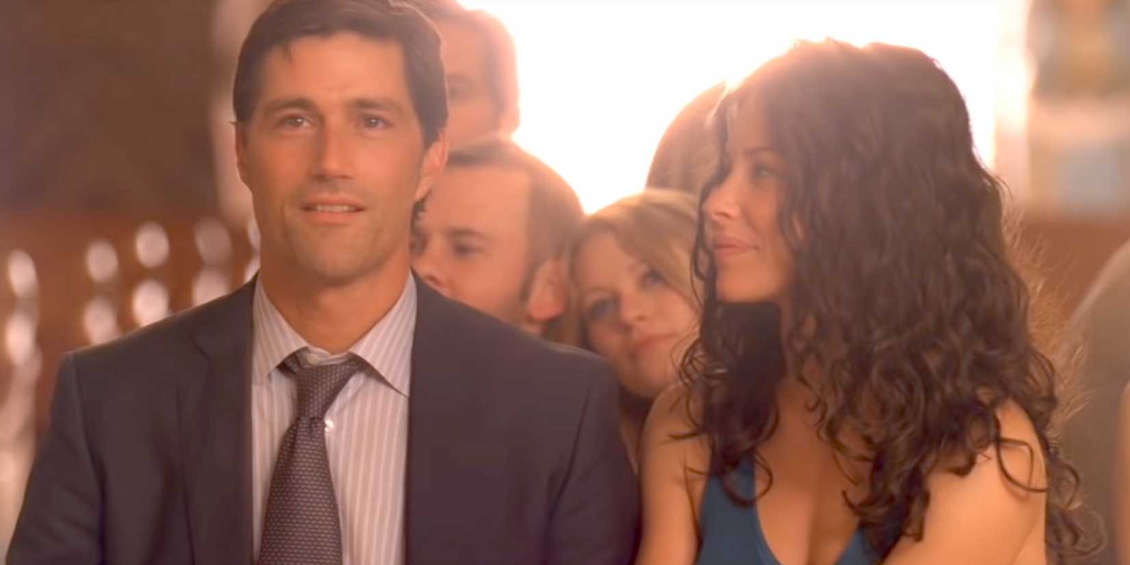 Matthew Fox as Jack Shephard and Evangeline Lilly as Kate Austen looking happy in church
