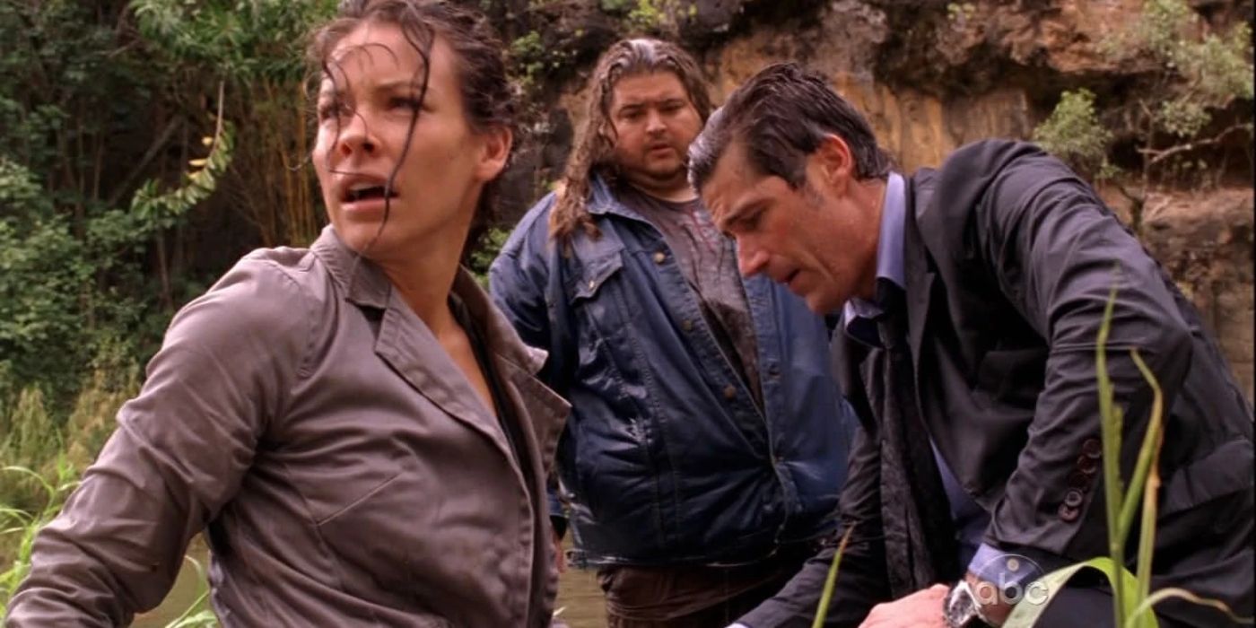 Kate, Hurley and Jack on the island in the rain in Lost