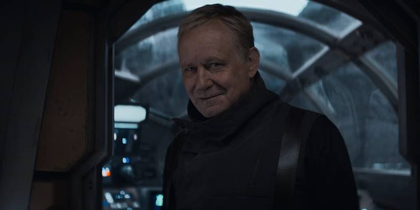 Stellan Skarsgard as Luthen Rael smiling in Andor season 1 finale.