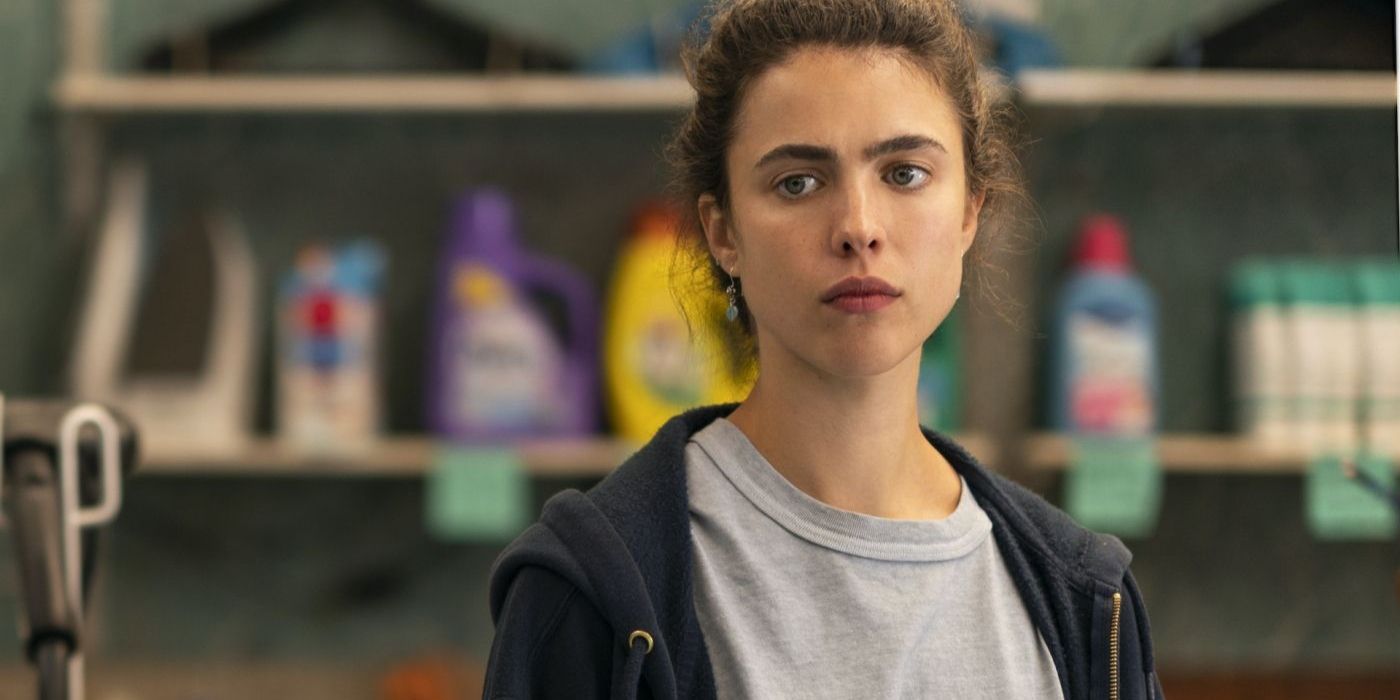 Margaret Qualley as Alex Russell standing in front of cleaning products in Maid