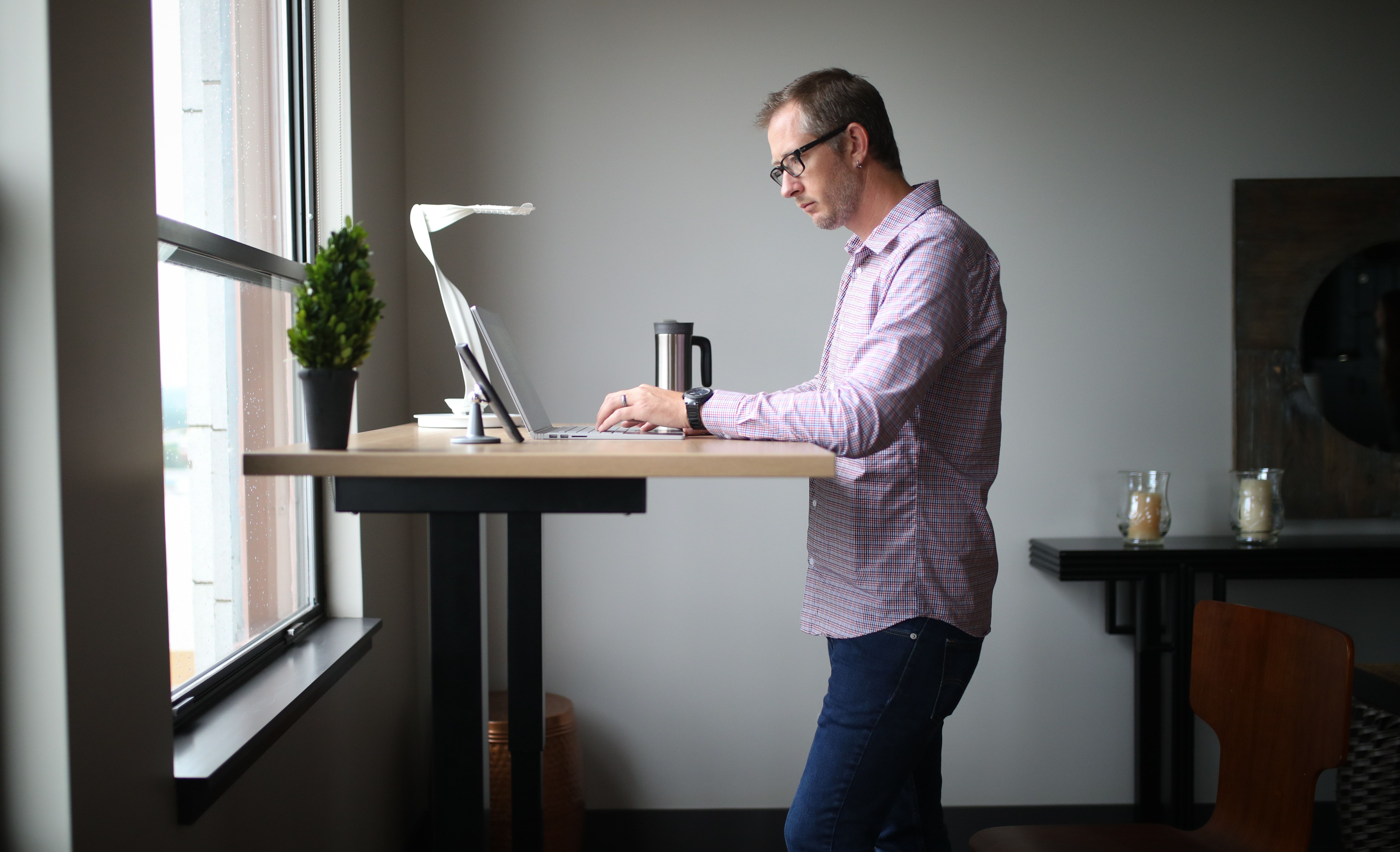 Man using standing desk