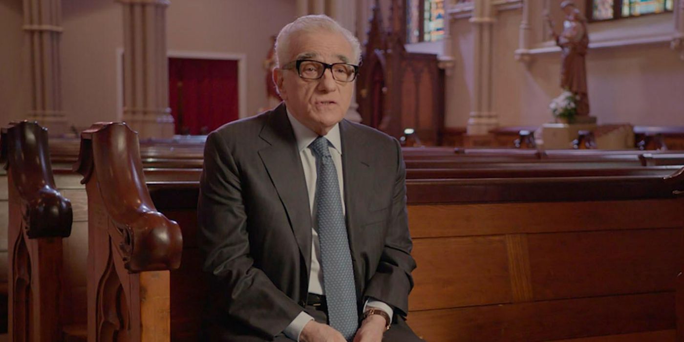 Martin Scorsese sitting in a church while talking in a documentary The Oratario
