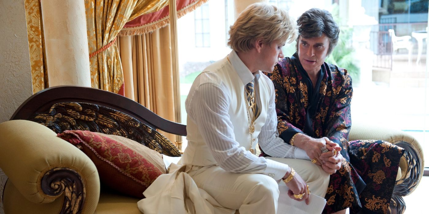 Matt damon as Scott Thorne and Michael Douglas as Liberace sitting and talking in Behind the Candelabra