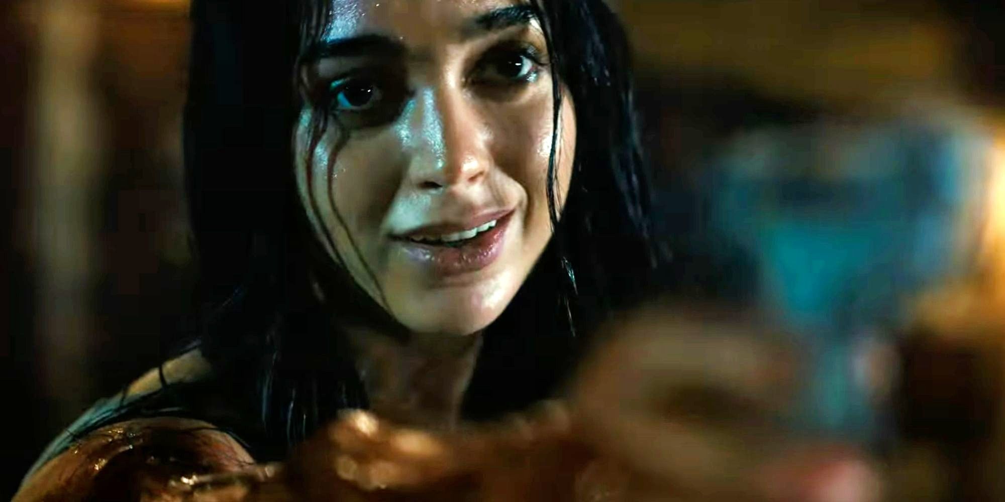 Melissa Barrera as Sam pointing a gun up in Scream 6