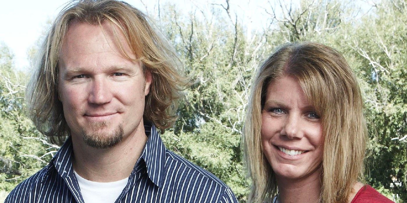 Meri and Kody Brown from Sister Wives posing in younger days outside smiling