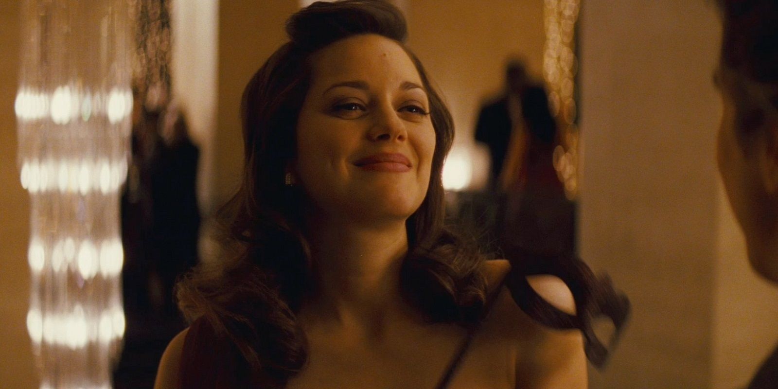 Miranda Tate (Talia Al Ghul) smiles in The Dark Knight Rises