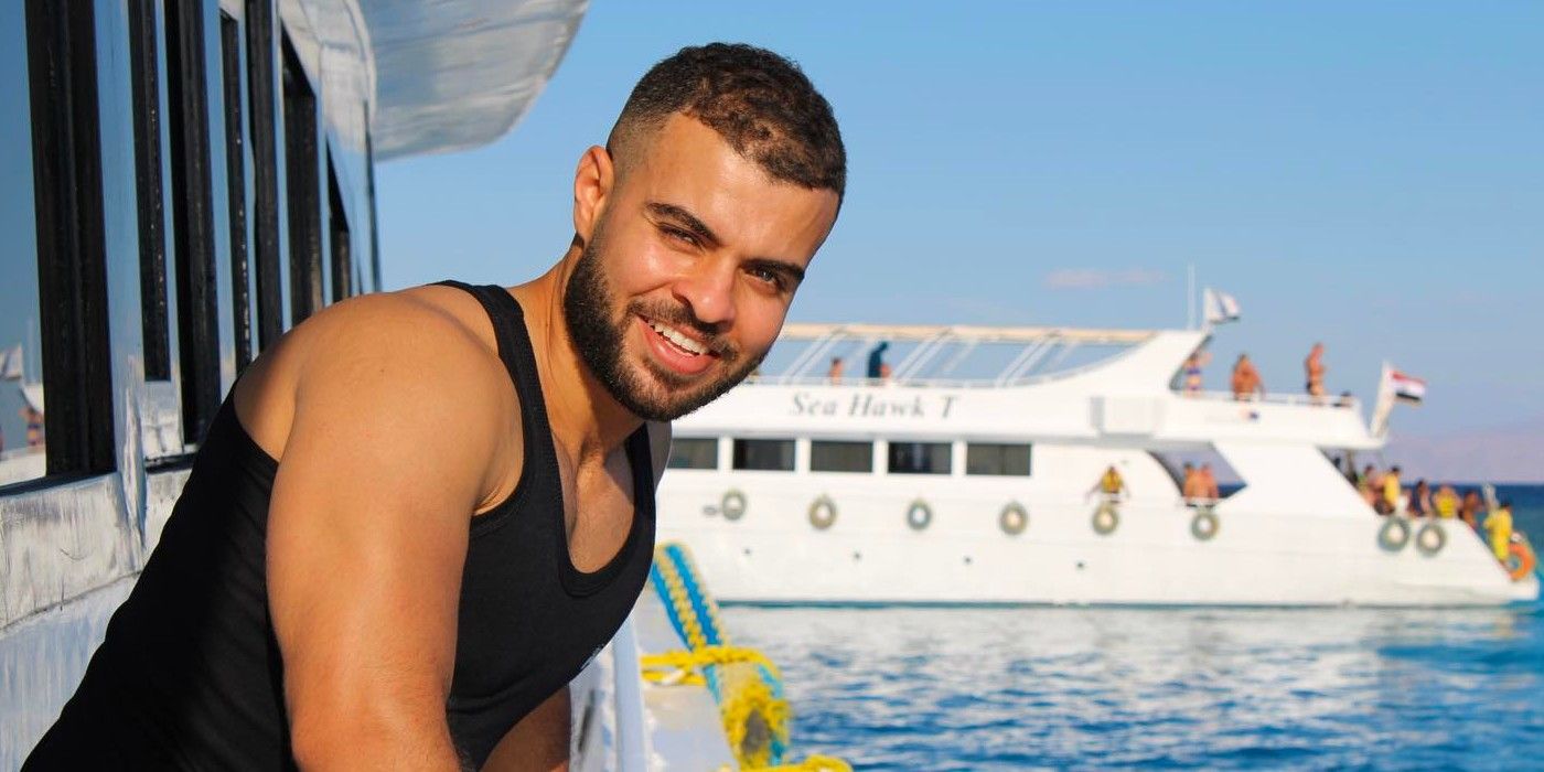 90 Day Fiancé star Mohamed Abdelhamedsmiling on boat