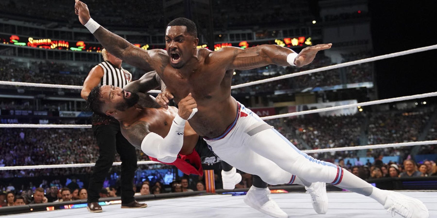 Montez Ford waylays his opponent during a match at WWE SummerSlam in 2022.