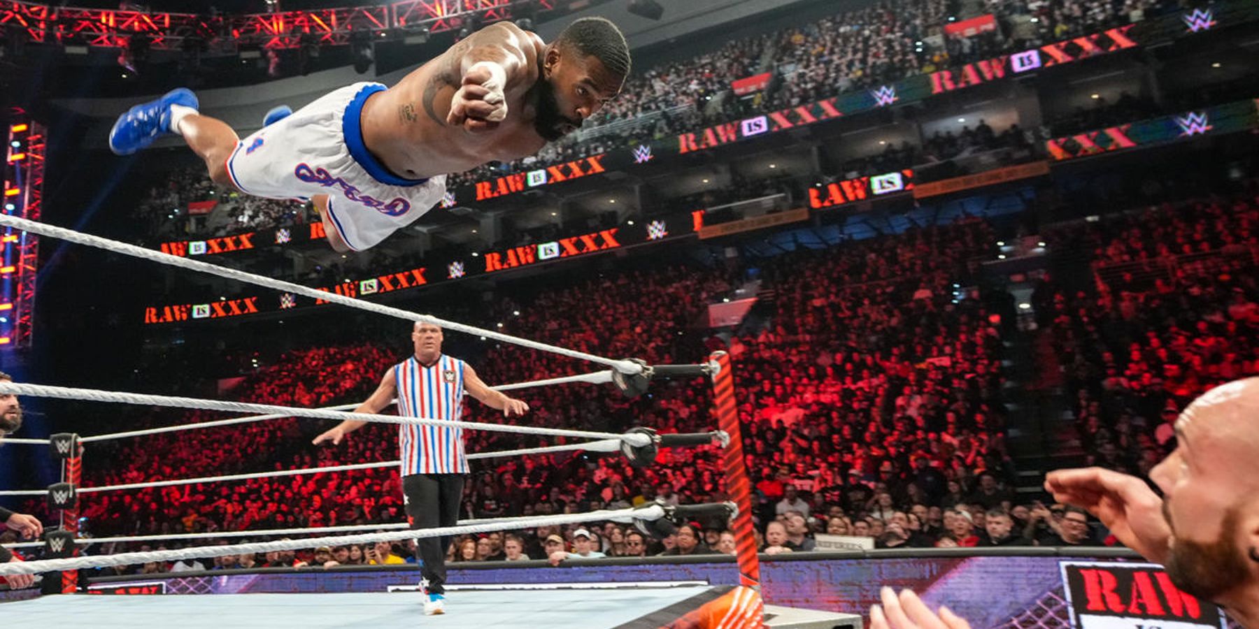 Montez Ford launches himself over the top rope during WWE's Raw is 30 episode in January 2023.