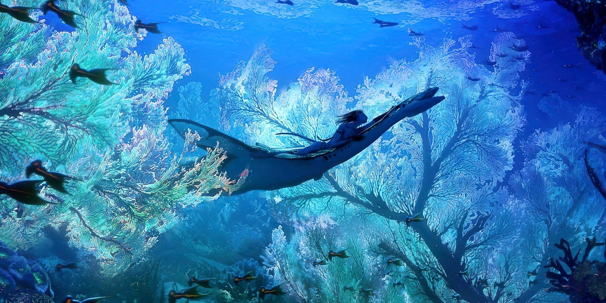 Navi riding an underwater creature through a coral reef in Avatar The Way of Water