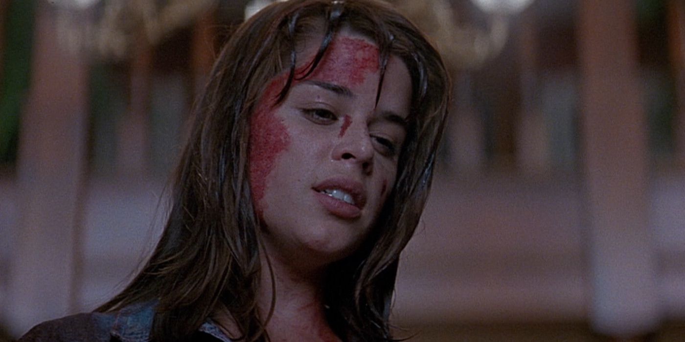 Neve Campbell looks on with a bloody face from Scream 1996